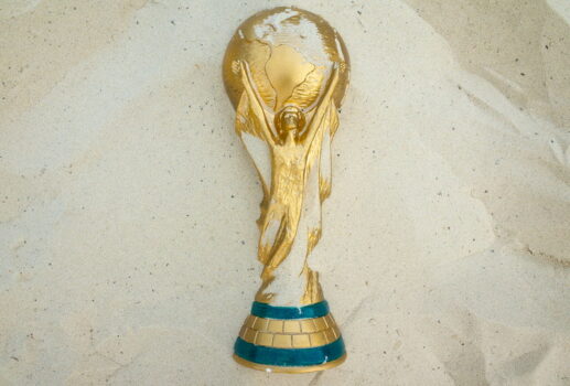 world cup trophy lying in sand